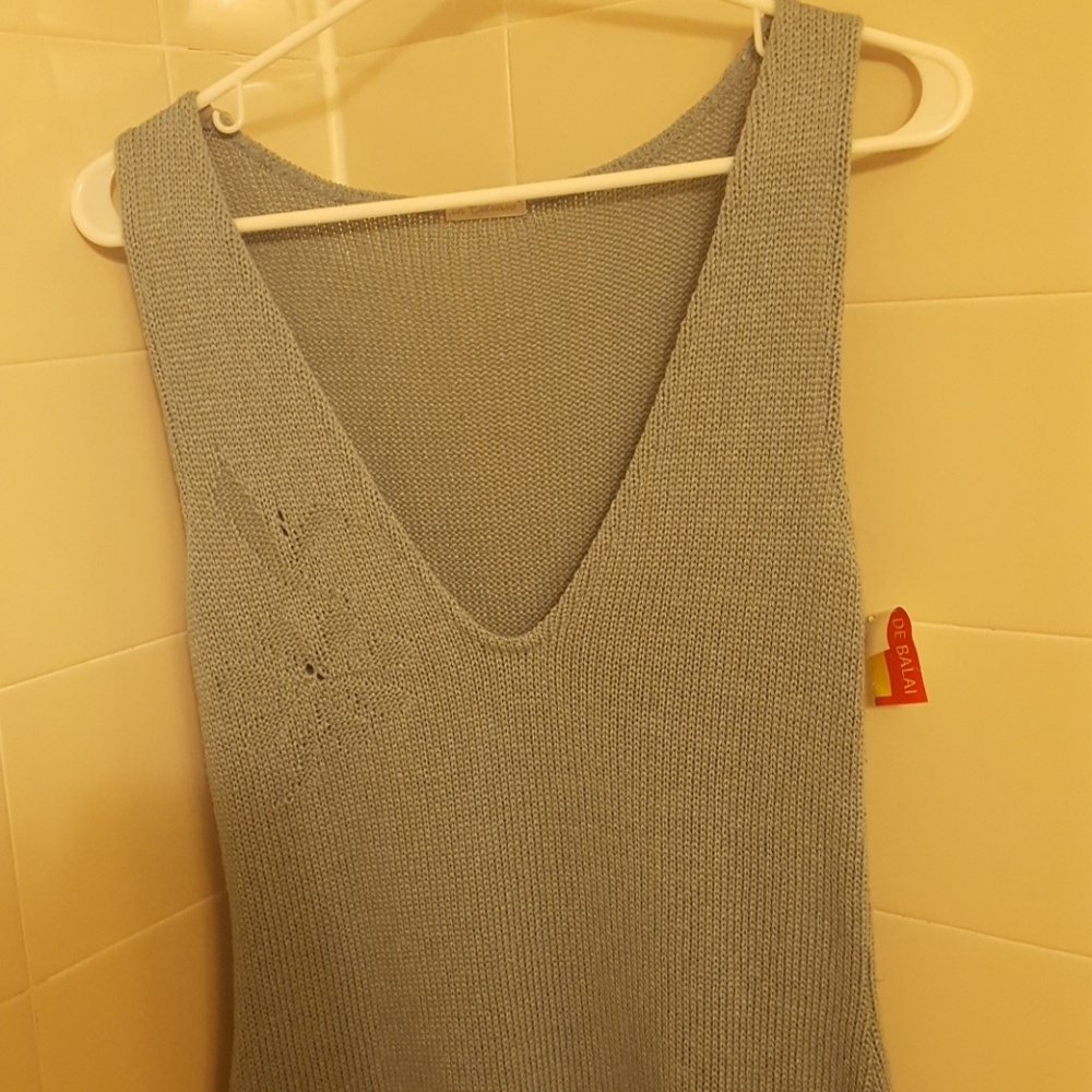 Unworn, tagged, one-size tunic.